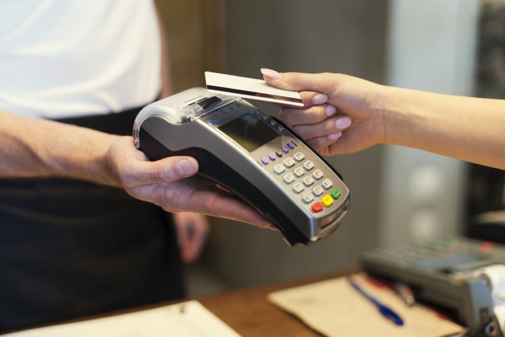 close-up-customer-paying-by-credit-card-min